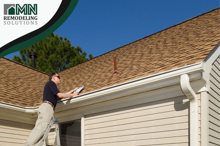MN Remodeling Solutions inspecting roof damage in Plymouth, MN.